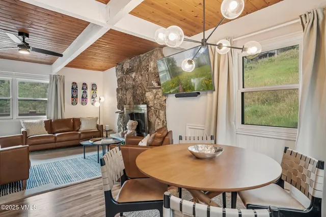 a view of a dining room with furniture window and outside view