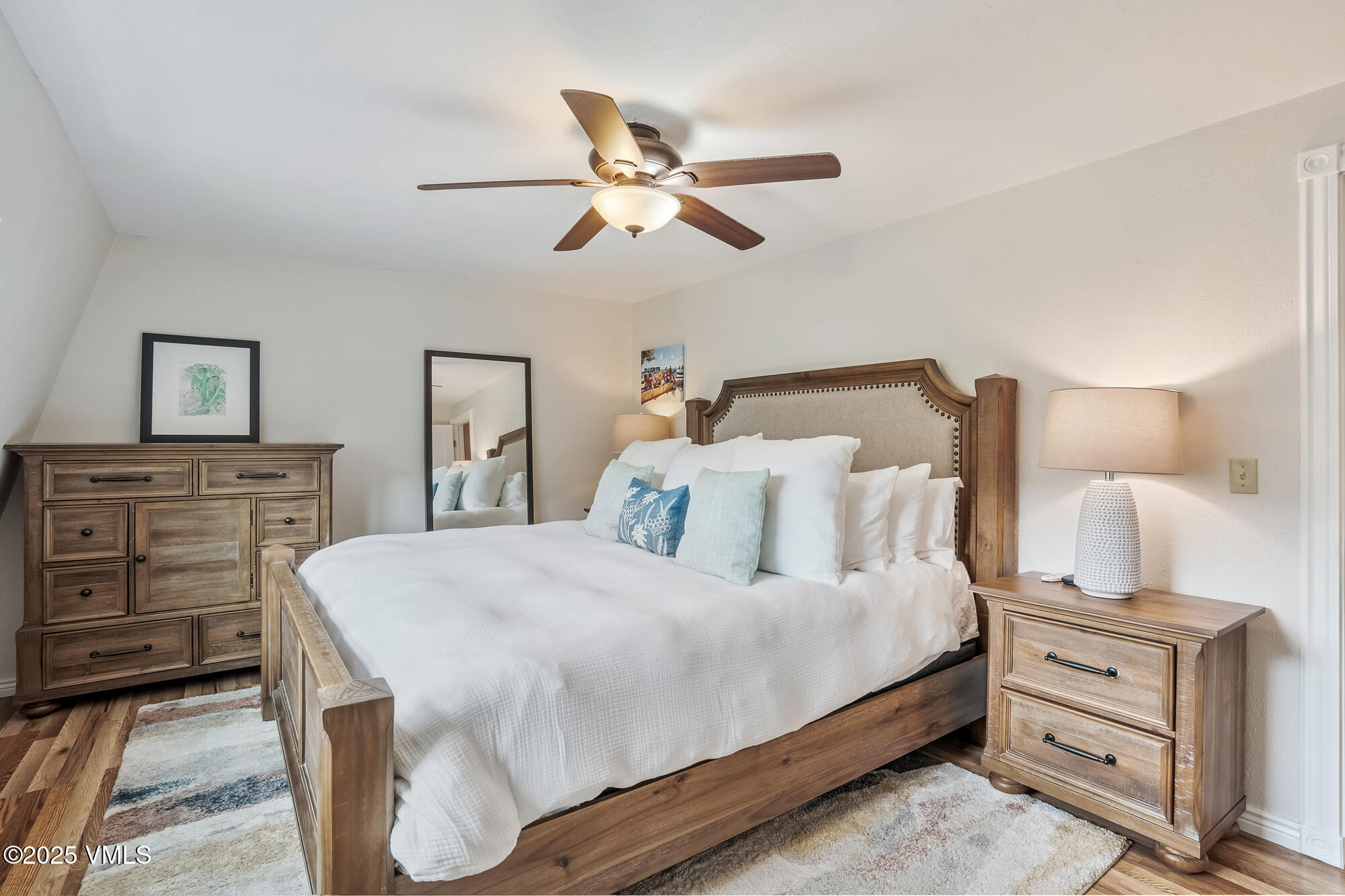 2487 Chamonix Lane, Unit F1 Vail, CO 81657 - Photo 9 of 27 a bedroom with a bed and a dresser