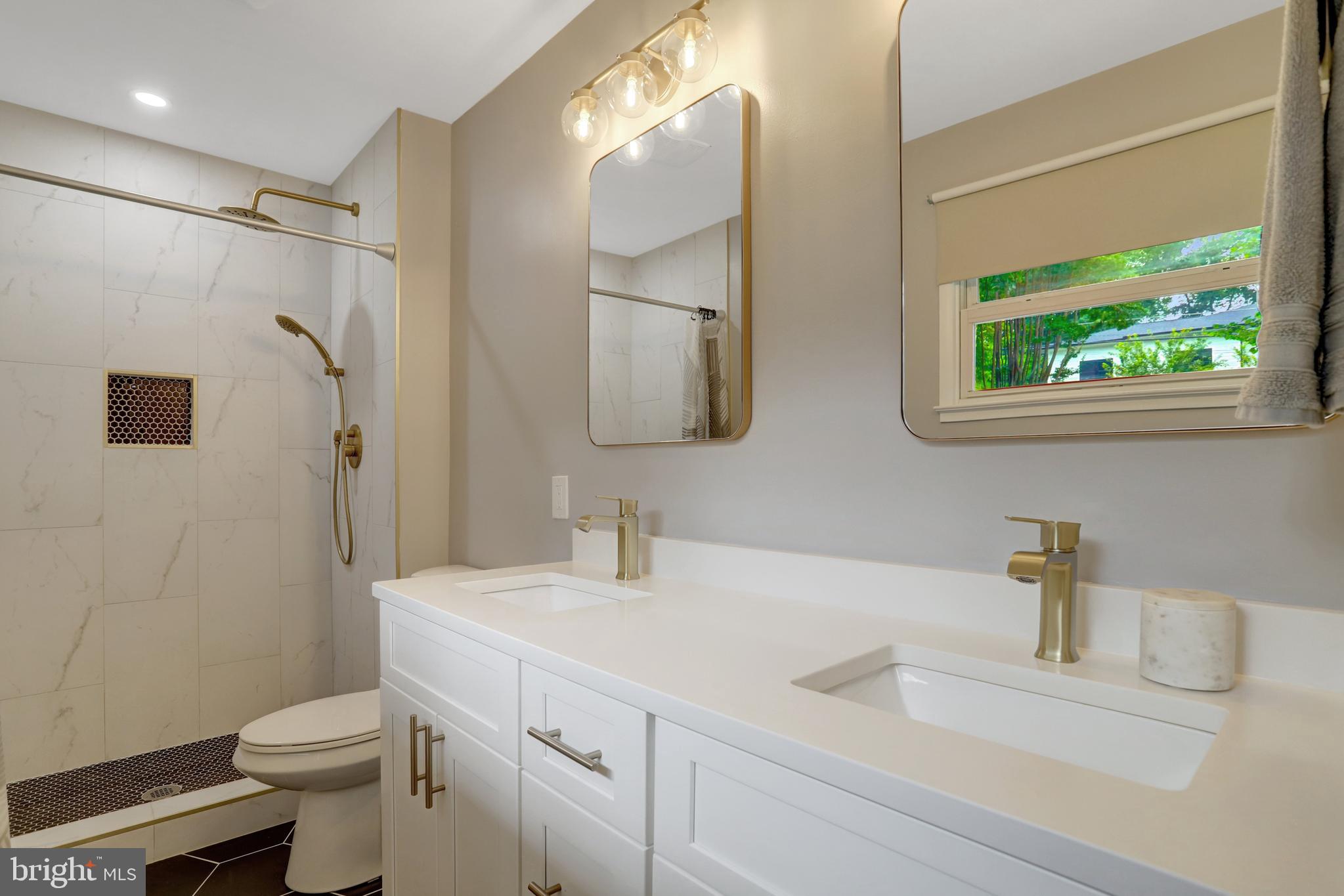 5418 Inverchapel Road Springfield, VA 22151 - Photo 22 of 94 a bathroom with a sink a toilet and shower