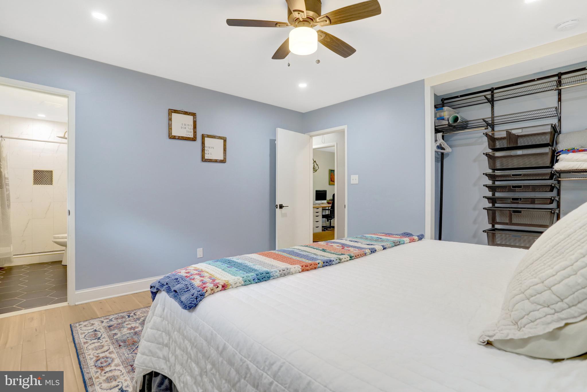 5418 Inverchapel Road Springfield, VA 22151 - Photo 26 of 94 a bedroom with a bed and a chandelier