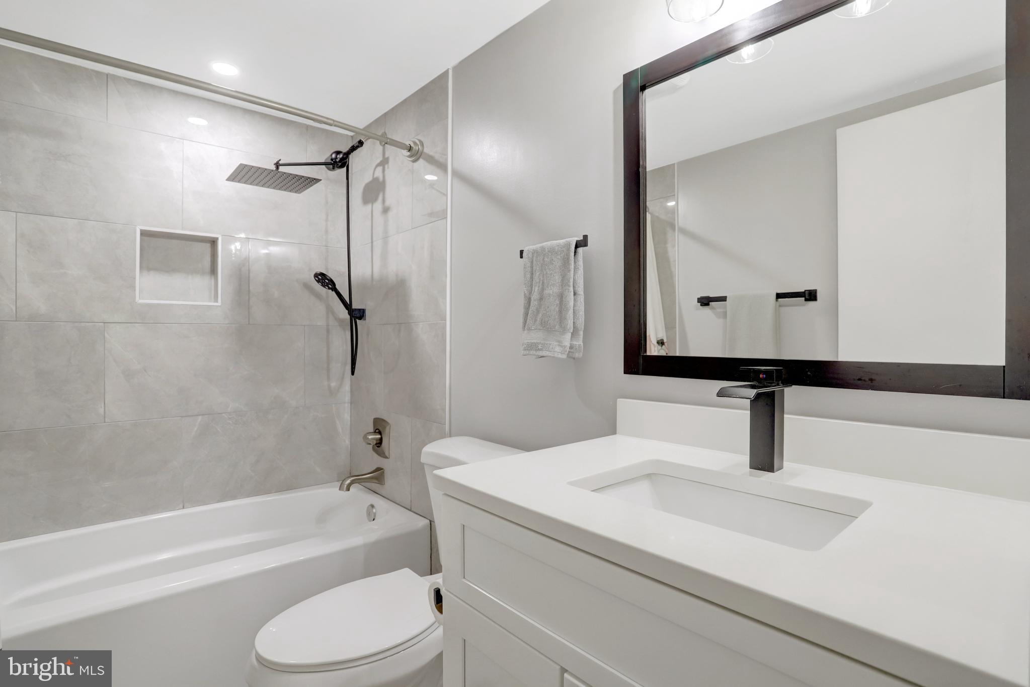 5418 Inverchapel Road Springfield, VA 22151 - Photo 50 of 94 a bathroom with a sink a toilet and a mirror