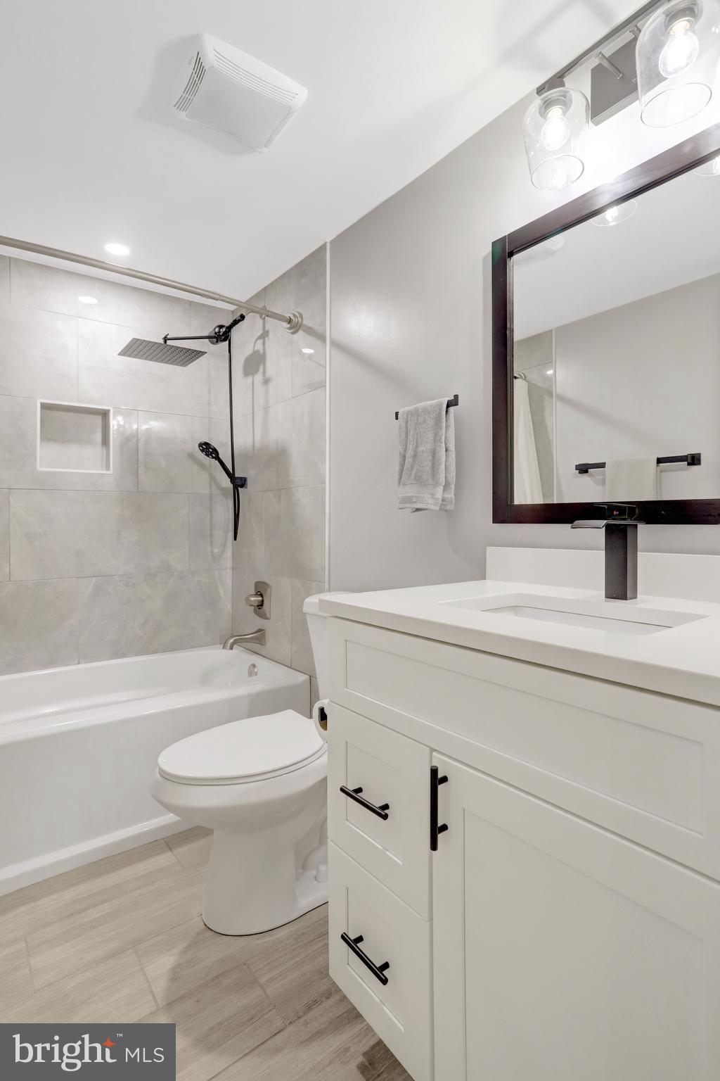 5418 Inverchapel Road Springfield, VA 22151 - Photo 51 of 94 a bathroom with a sink a toilet and a mirror