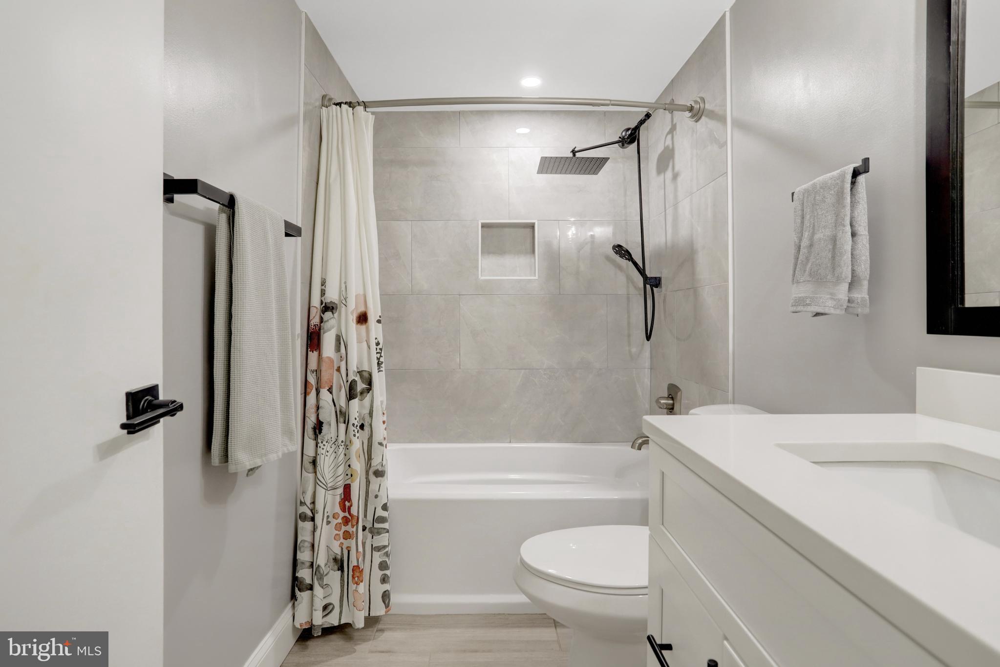 5418 Inverchapel Road Springfield, VA 22151 - Photo 52 of 94 a bathroom with a sink toilet and shower