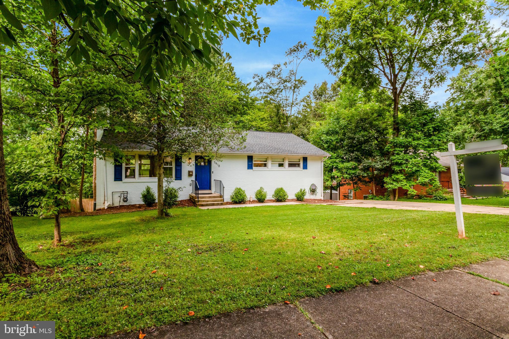 5418 Inverchapel Road Springfield, VA 22151 - Photo 93 of 94 a front view of a house with a yard and trees