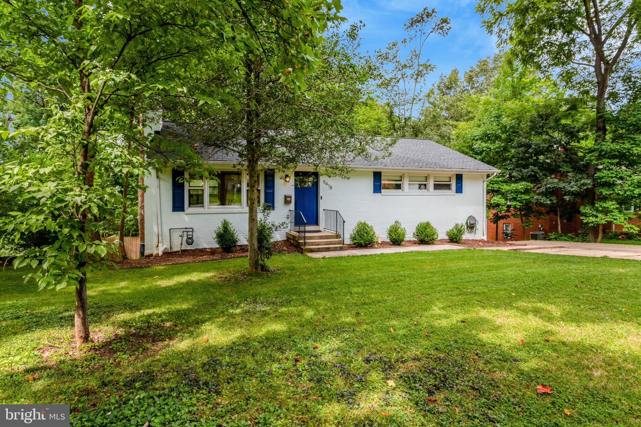 5418 Inverchapel Road Springfield, VA 22151 - Photo 94 of 94 a front view of a house with a yard and trees