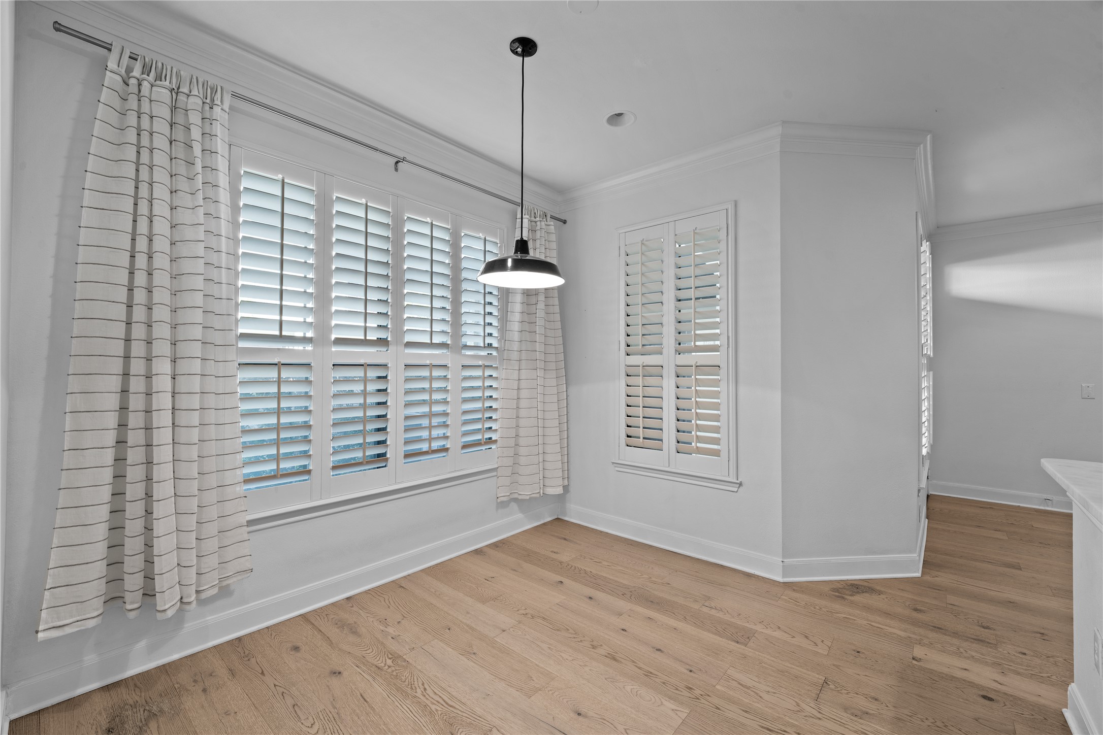 7701 Rialto Boulevard, Unit 1412 Austin, TX 78735 - Photo 13 of 30 a view of empty room with wooden floor and fan