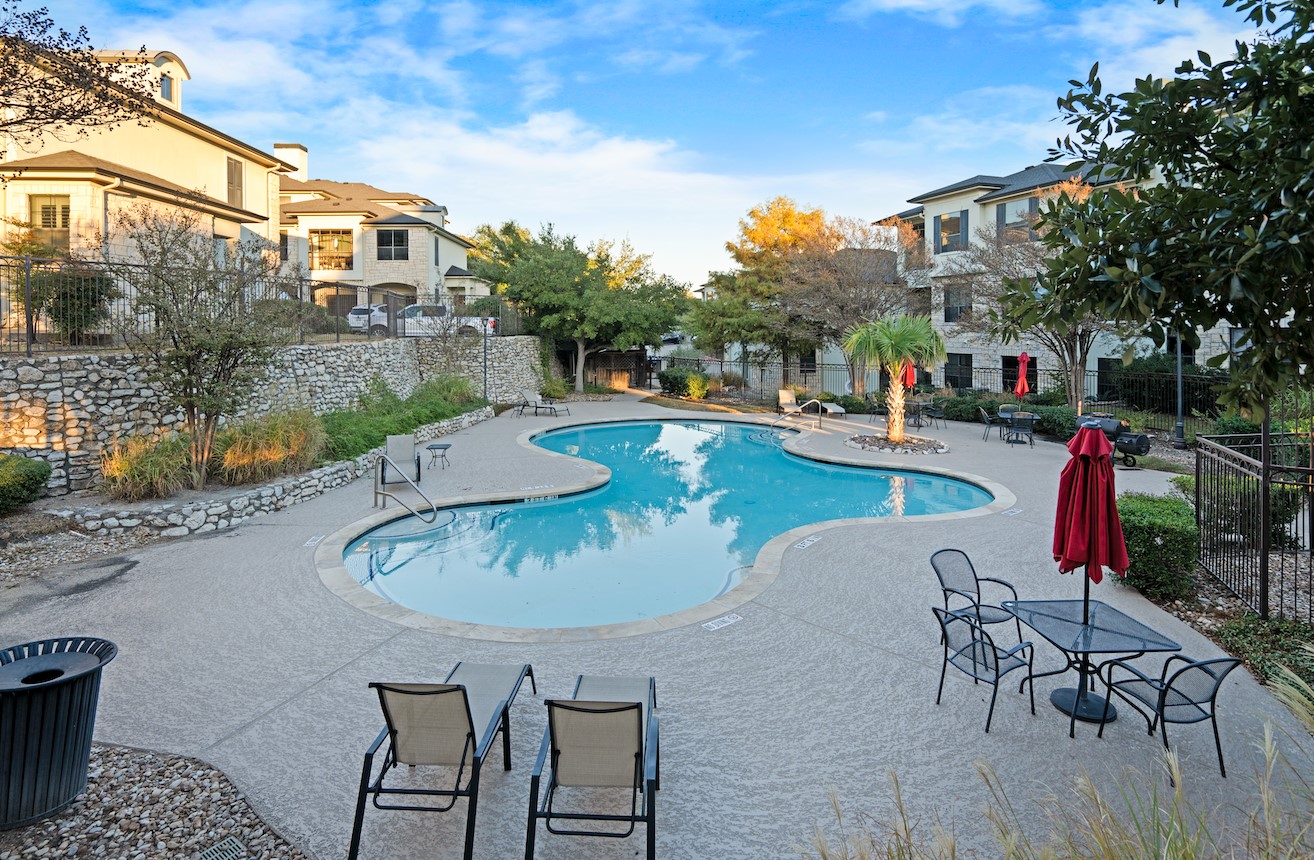 7701 Rialto Boulevard, Unit 1412 Austin, TX 78735 - Photo 29 of 30 a swimming pool with outdoor seating and yard