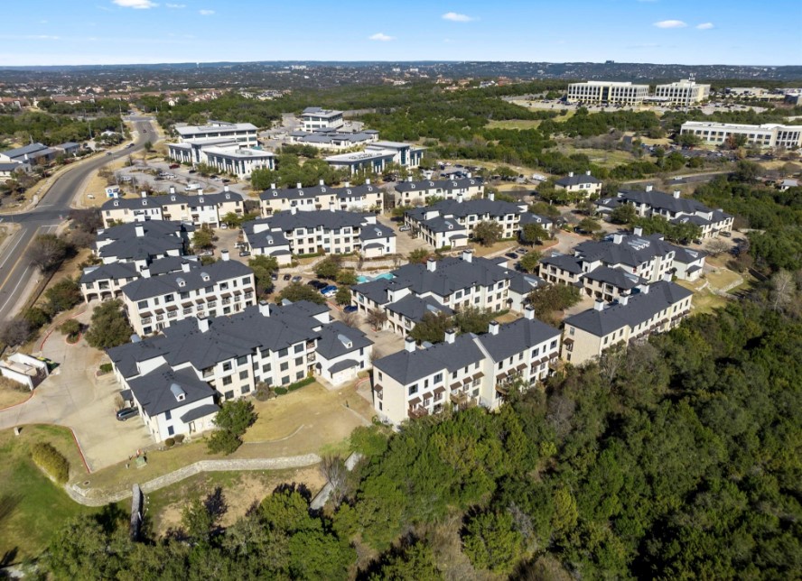 7701 Rialto Boulevard, Unit 1412 Austin, TX 78735 - Photo 30 of 30 an aerial view of residential building with parking space