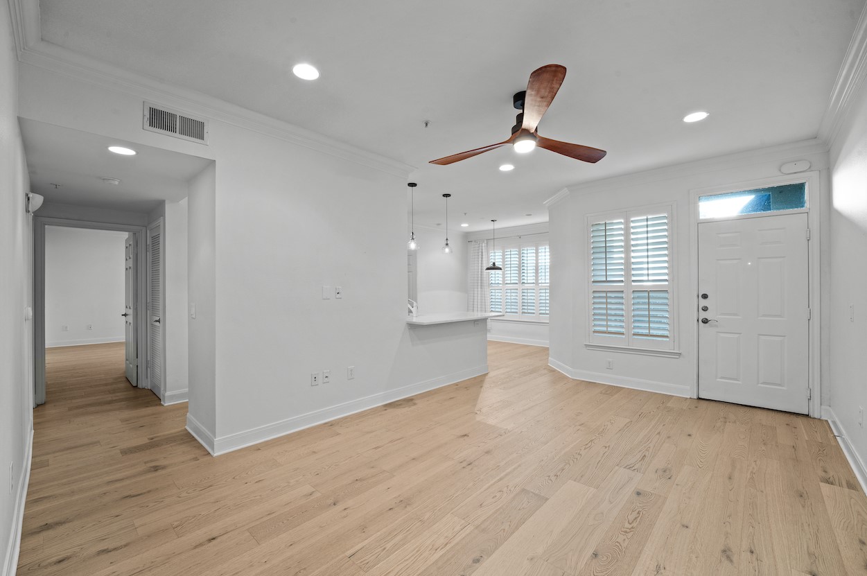 7701 Rialto Boulevard, Unit 1412 Austin, TX 78735 - Photo 4 of 30 a view of an empty room and wooden floor