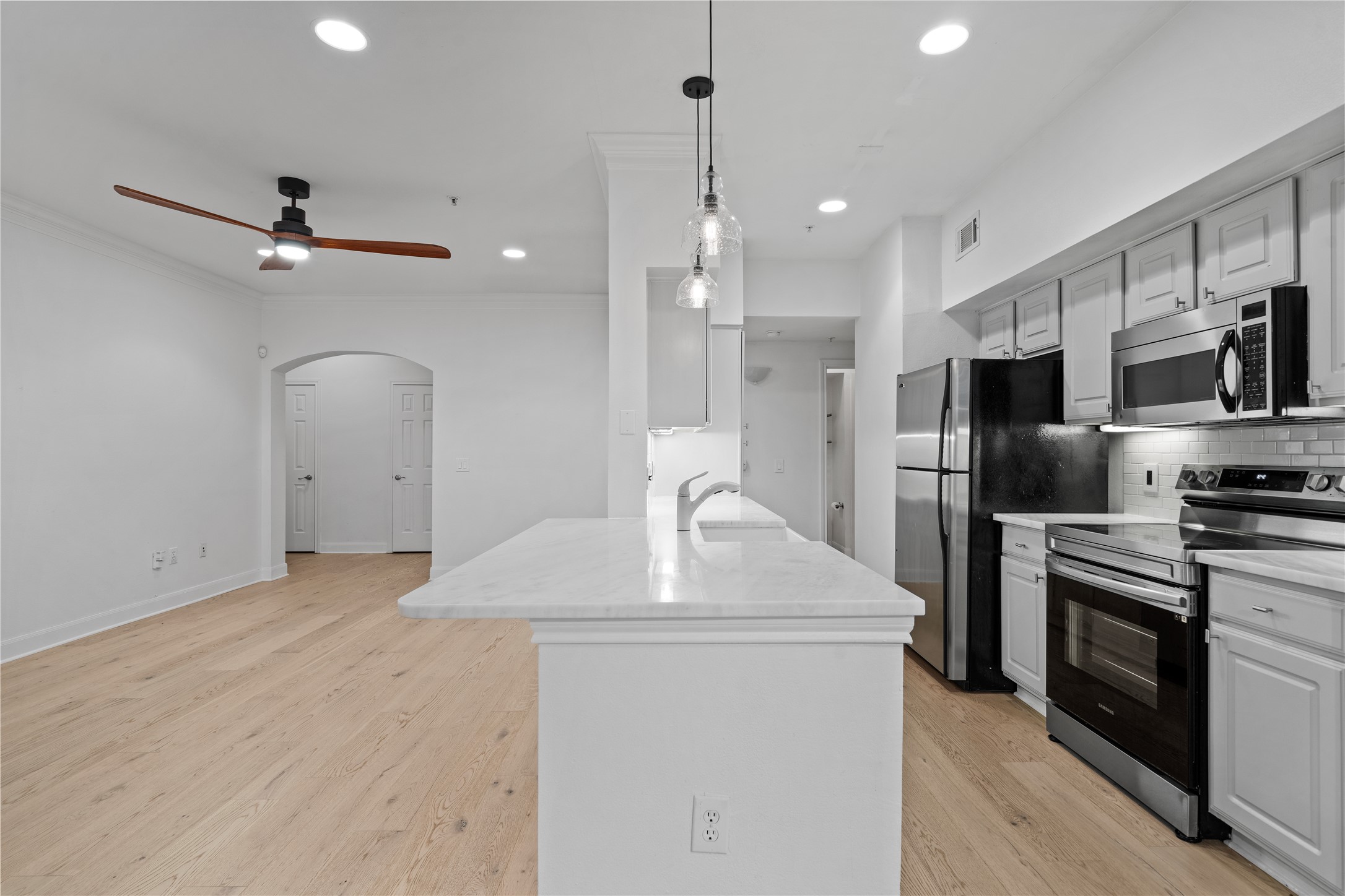 7701 Rialto Boulevard, Unit 1412 Austin, TX 78735 - Photo 7 of 30 a kitchen with stainless steel appliances a refrigerator sink and stove