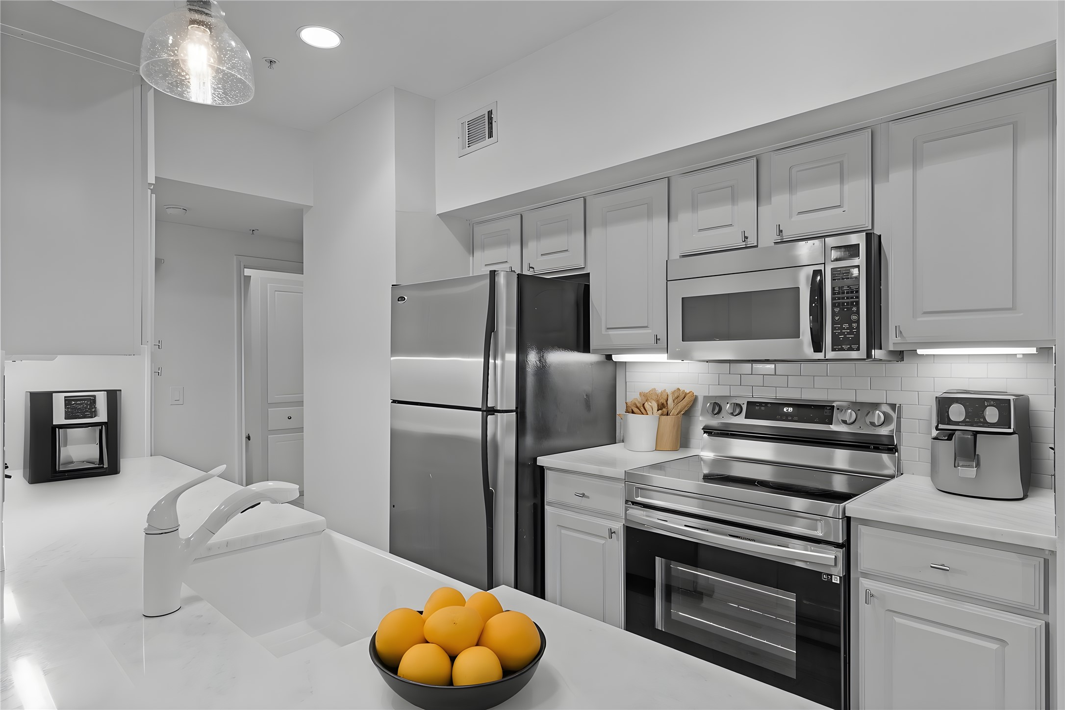 7701 Rialto Boulevard, Unit 1412 Austin, TX 78735 - Photo 8 of 30 a kitchen with appliances a sink and cabinets