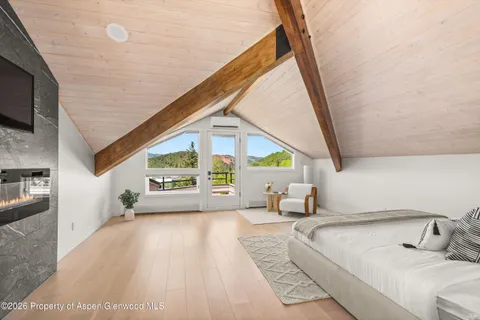 a bedroom with a bed and window