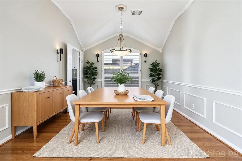 7313 San Carlos Drive Rowlett, TX 75089 - Photo 13 of 40 a view of a dining room with furniture window and wooden floor