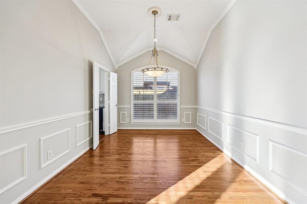 7313 San Carlos Drive Rowlett, TX 75089 - Photo 14 of 40 a view of an empty room with wooden floor and a window