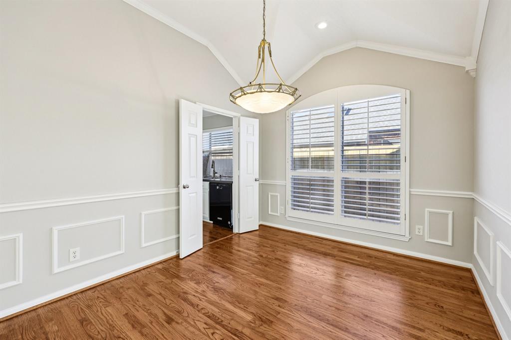 7313 San Carlos Drive Rowlett, TX 75089 - Photo 15 of 40 a view of an empty room with wooden floor and a window