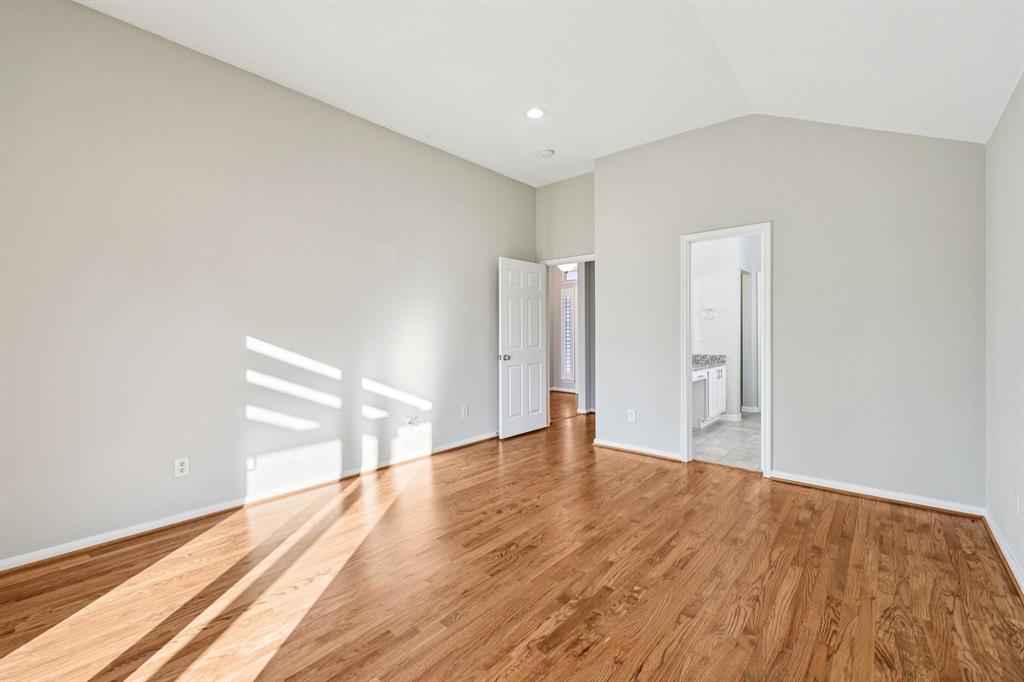 7313 San Carlos Drive Rowlett, TX 75089 - Photo 24 of 40 a view of an empty room with wooden floor