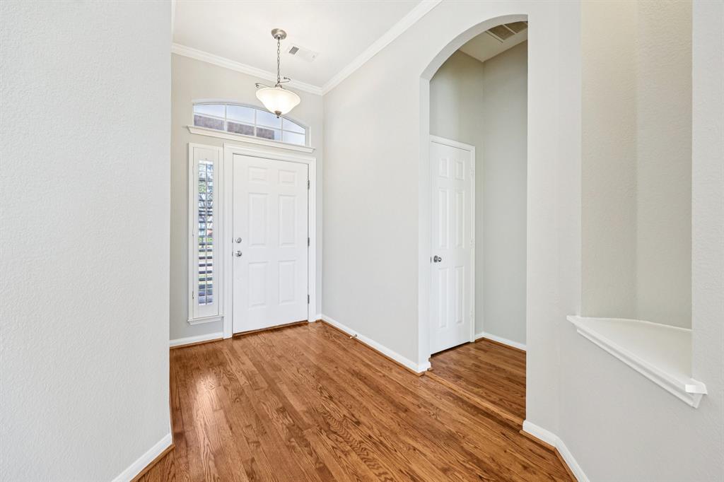 7313 San Carlos Drive Rowlett, TX 75089 - Photo 7 of 40 a view of empty room with wooden floor and fan