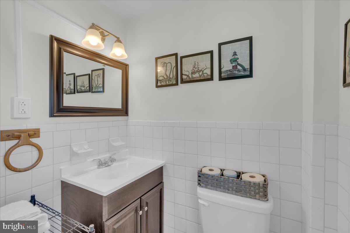 166 Sproul Road Malvern, PA 19355 - Photo 13 of 20 a bathroom with a sink mirror and vanity