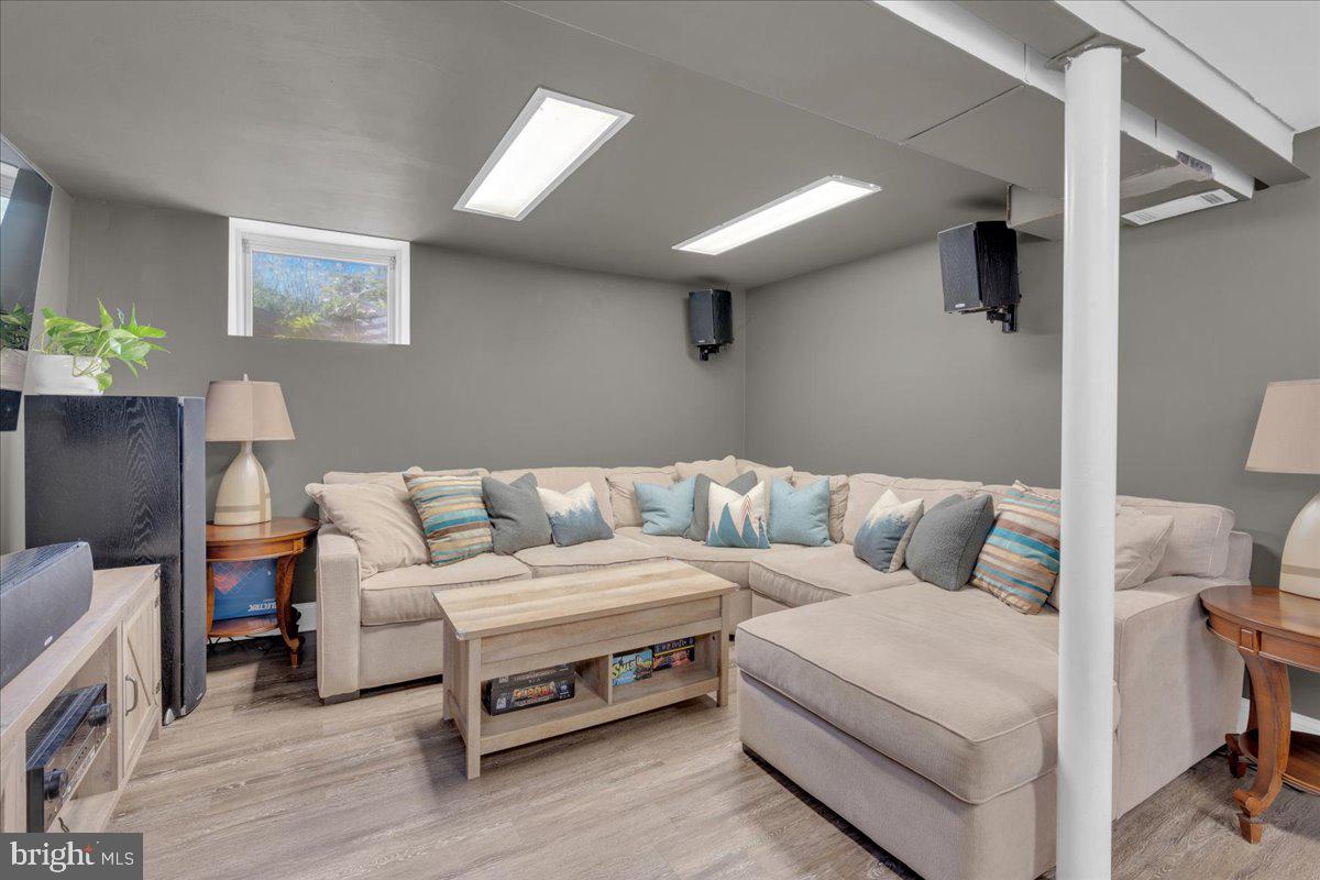 166 Sproul Road Malvern, PA 19355 - Photo 18 of 20 a living room with furniture and a wooden floor