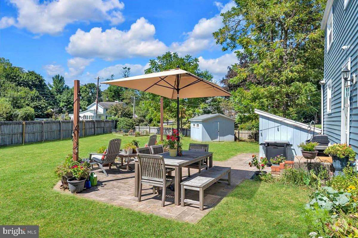 166 Sproul Road Malvern, PA 19355 - Photo 20 of 20 a view of a house with backyard sitting area and garden