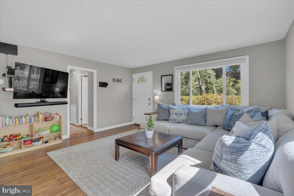 166 Sproul Road Malvern, PA 19355 - Photo 3 of 20 a living room with furniture and a flat screen tv