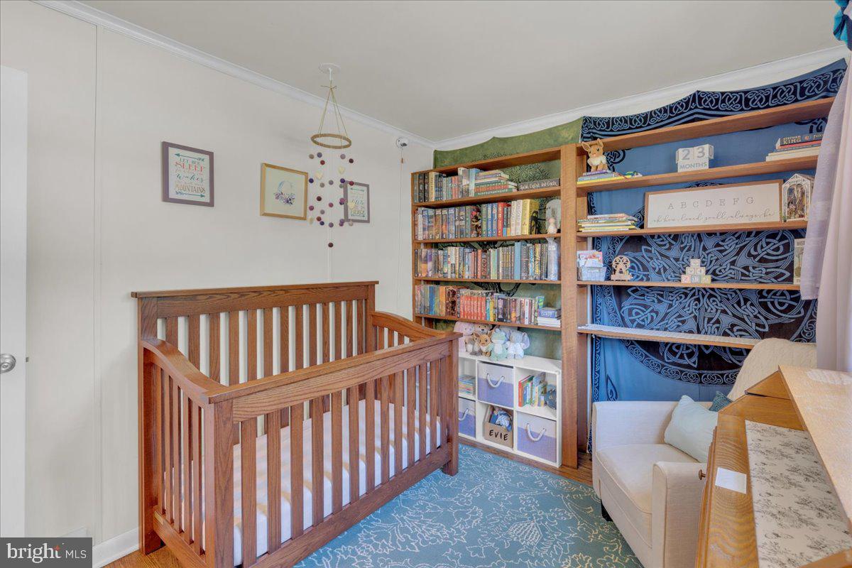 166 Sproul Road Malvern, PA 19355 - Photo 10 of 20 a living room with fish tank and a bookshelf