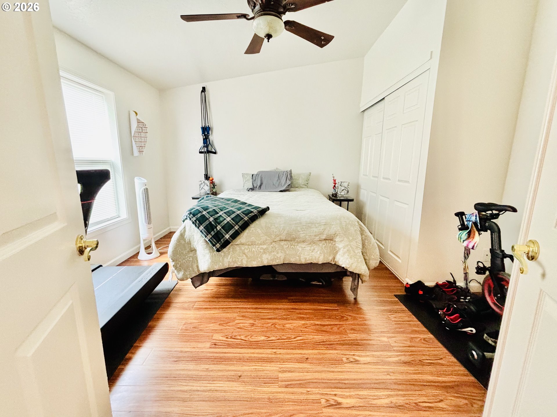 98190 Gavin Lane Brookings, OR 97415 - Photo 22 of 37 a bedroom with a bed and wooden floor