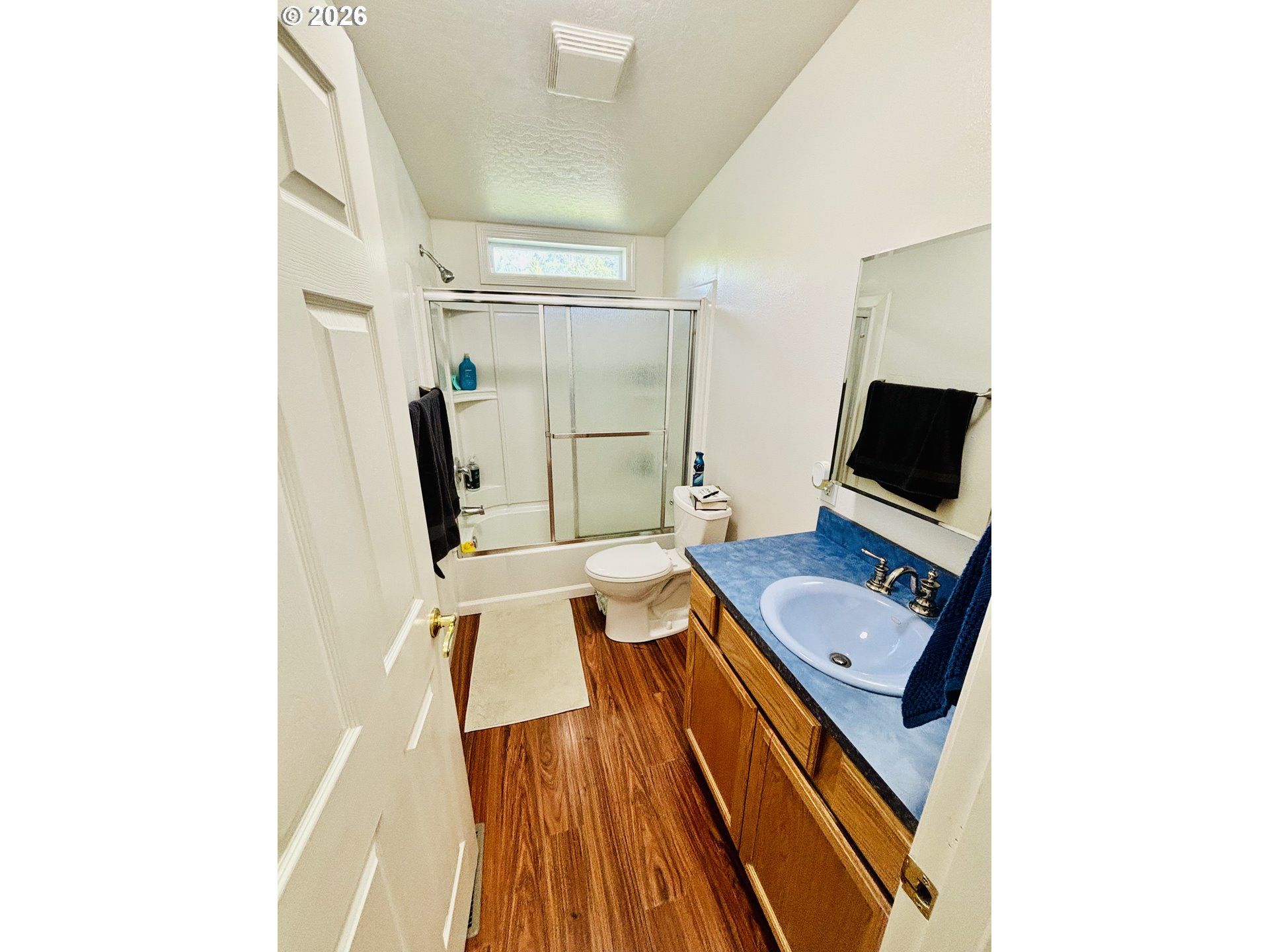 98190 Gavin Lane Brookings, OR 97415 - Photo 23 of 37 a bedroom with a bed and a flat screen tv