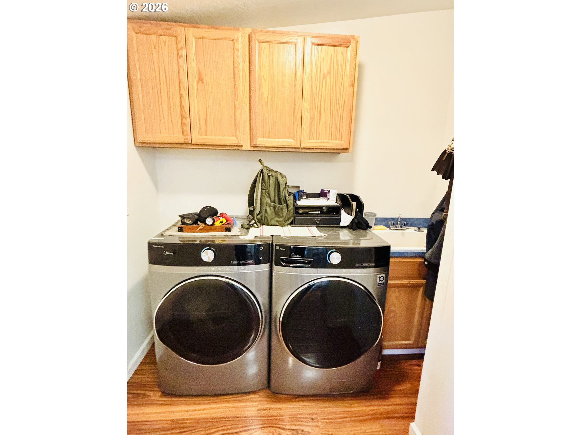 98190 Gavin Lane Brookings, OR 97415 - Photo 24 of 37 a utility room with sink dryer and washer