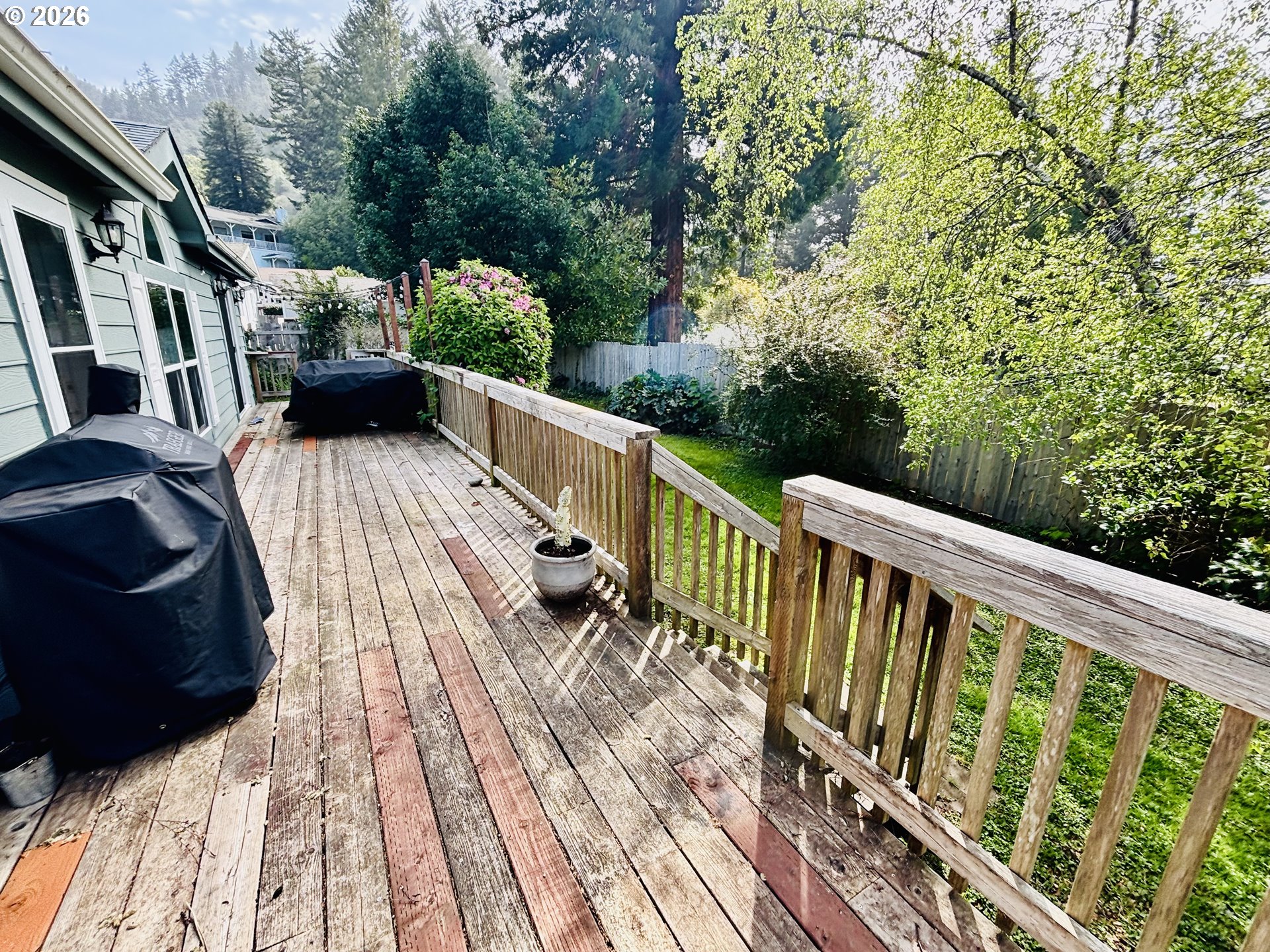 98190 Gavin Lane Brookings, OR 97415 - Photo 30 of 37 a view of balcony with wooden floor and fence