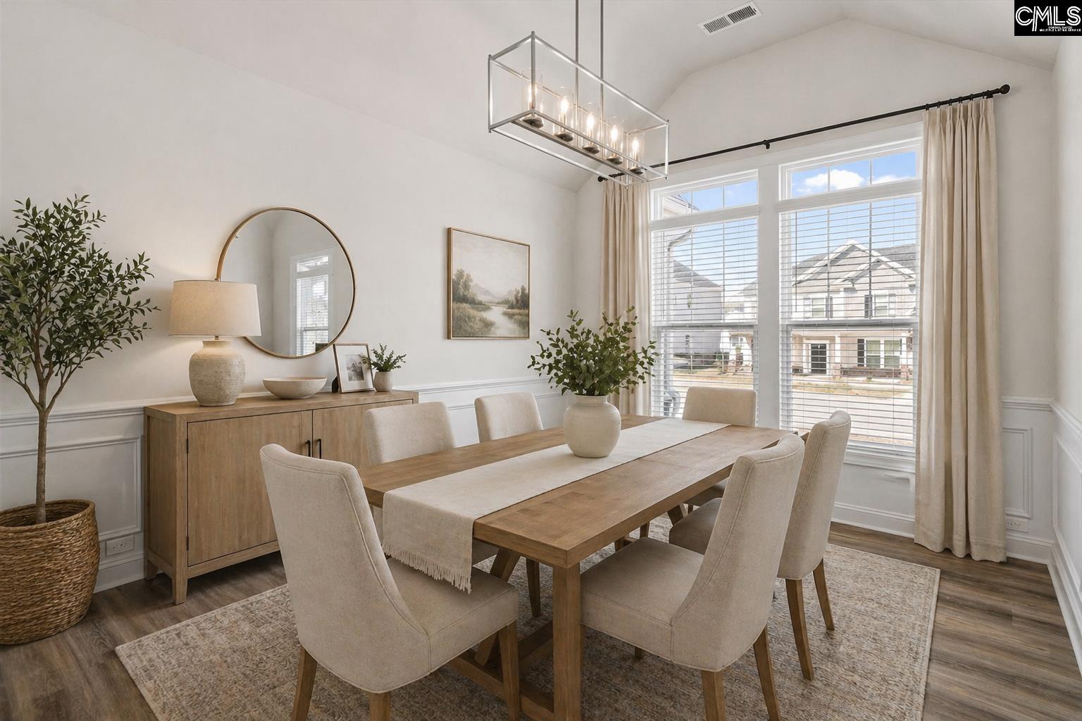 558 Wild Ginger Loop Irmo, SC 29063 - Photo 5 of 42 a dining room with furniture a chandelier and wooden floor