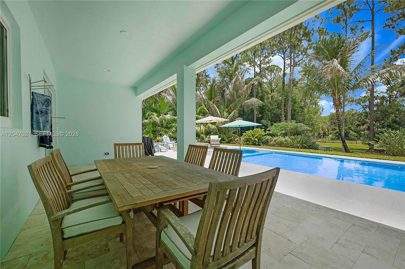 12127 154th Road North Jupiter, FL 33478 - Photo 42 of 67 Covered Patio and dining area