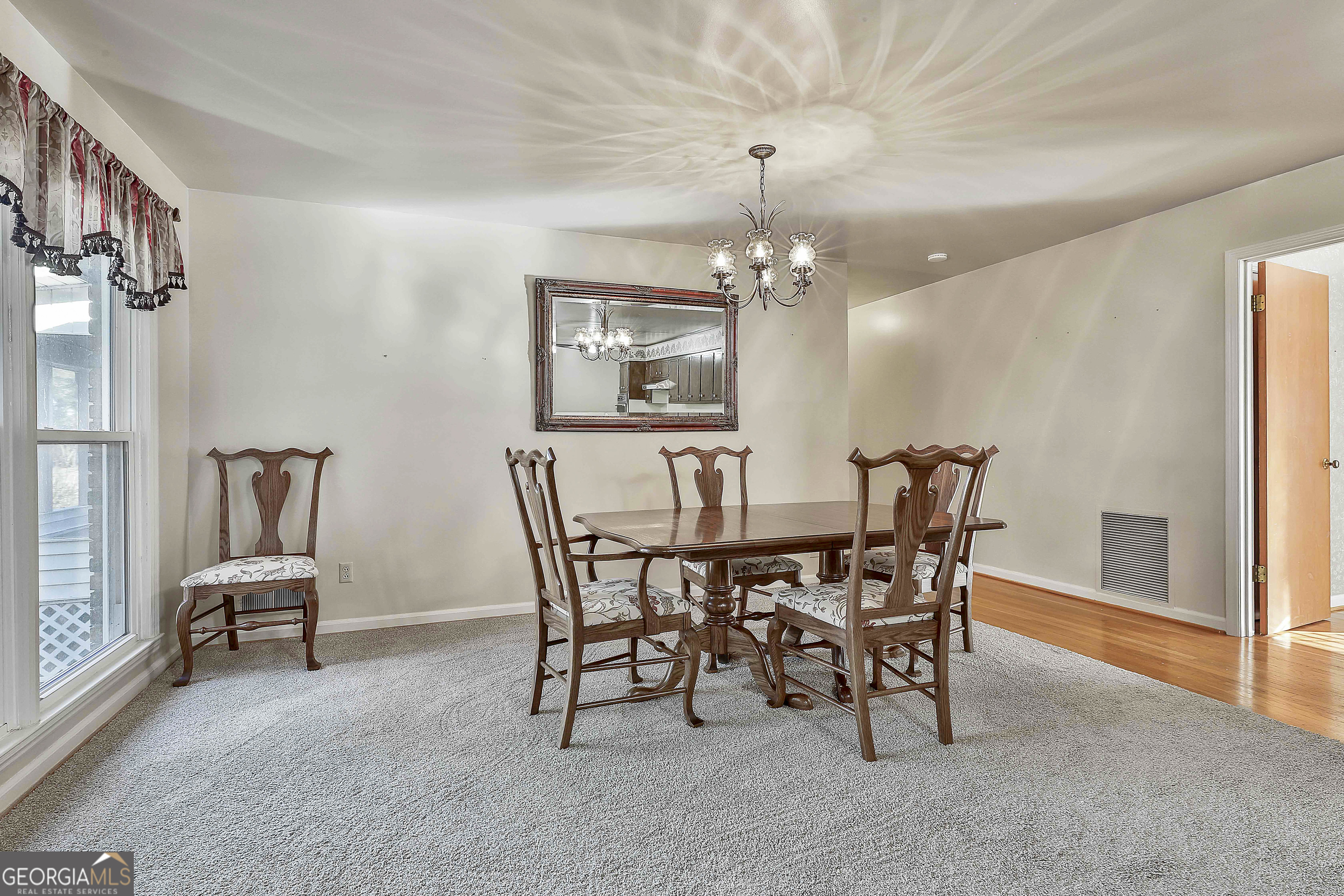 910 Line Creek Road Senoia, GA 30276 - Photo 14 of 56 a view of a dining room with furniture and chandelier