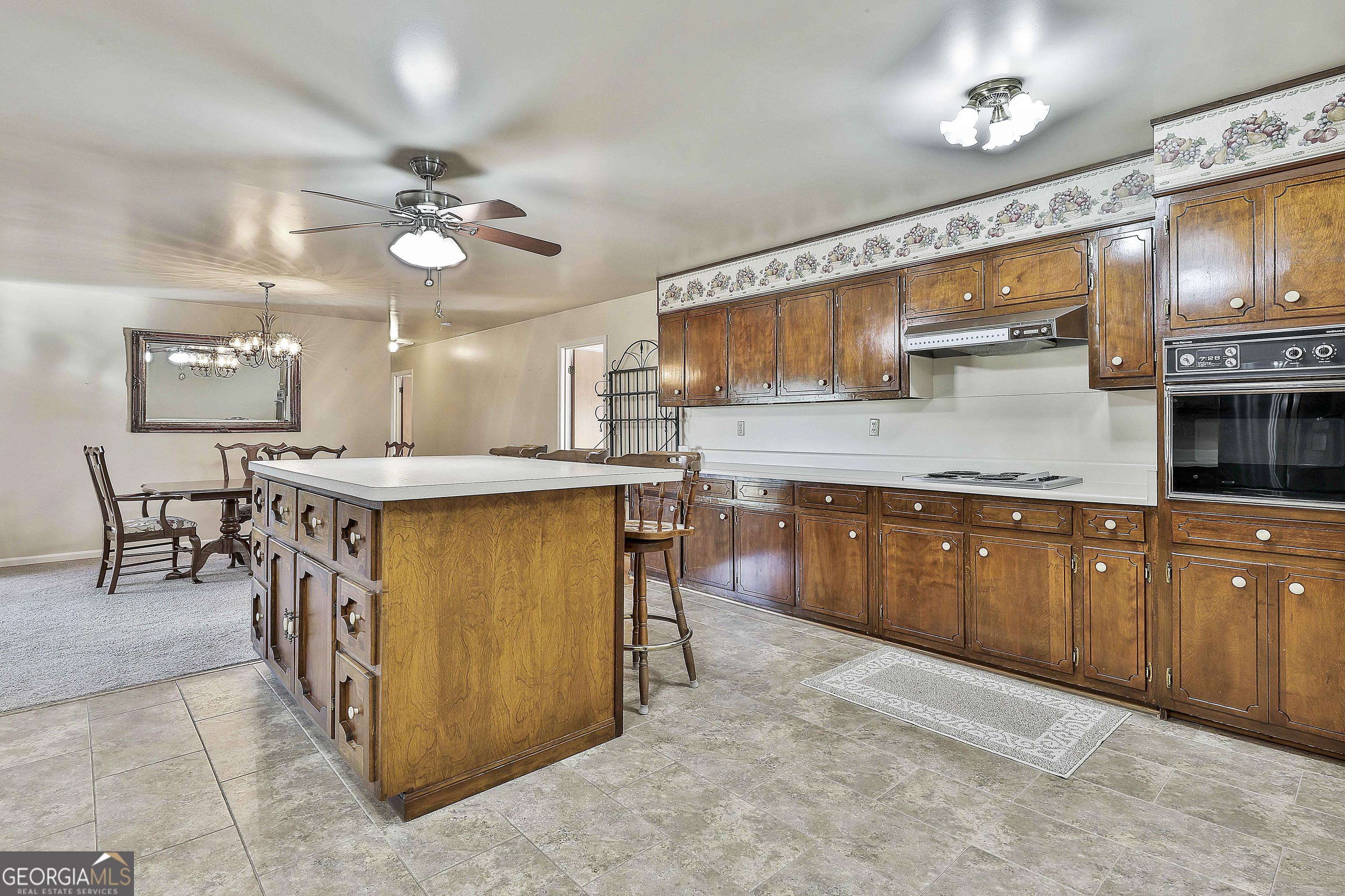 910 Line Creek Road Senoia, GA 30276 - Photo 18 of 56 a kitchen with a cabinets and chairs