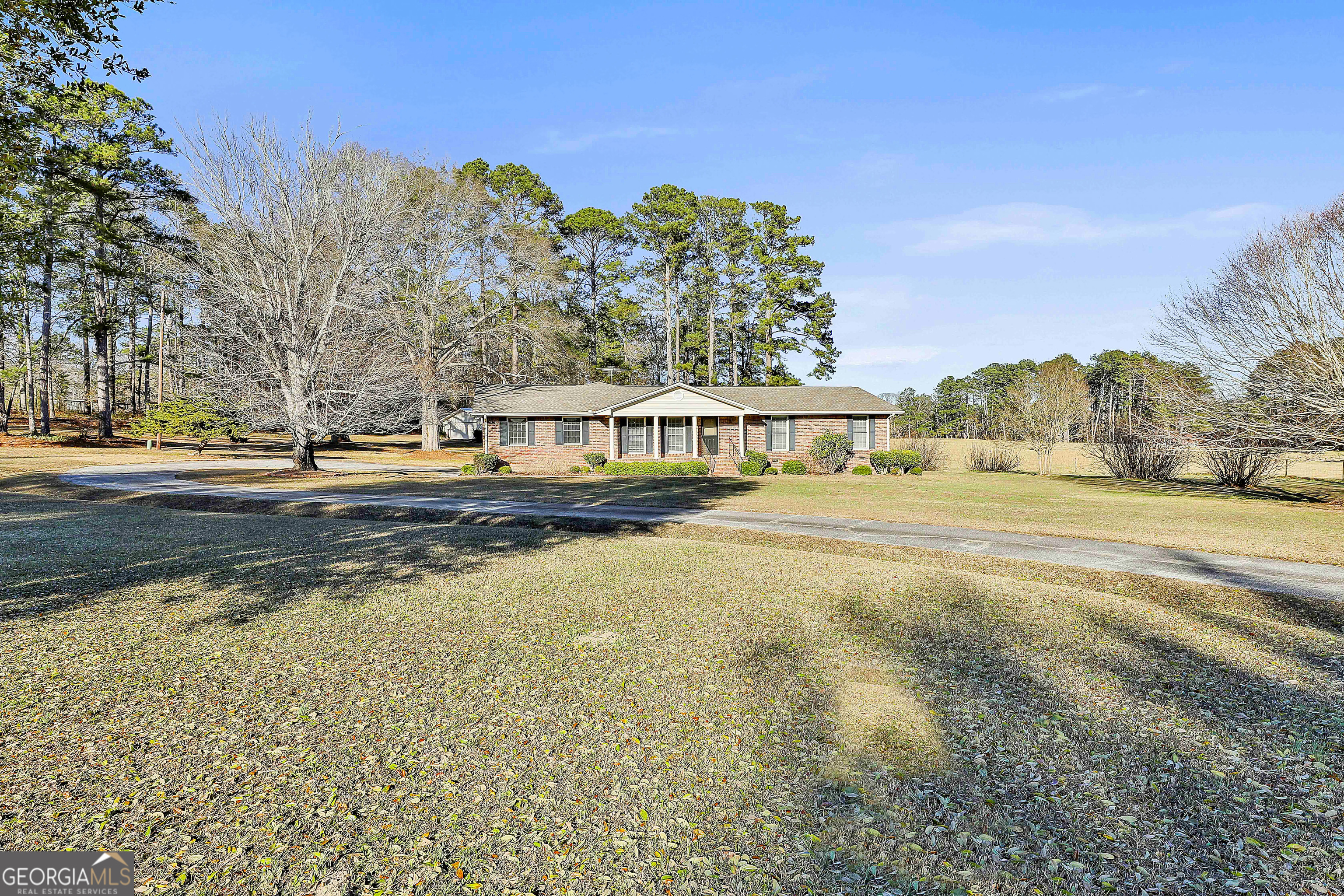 910 Line Creek Road Senoia, GA 30276 - Photo 2 of 56 a view of a swimming pool with an outdoor seating