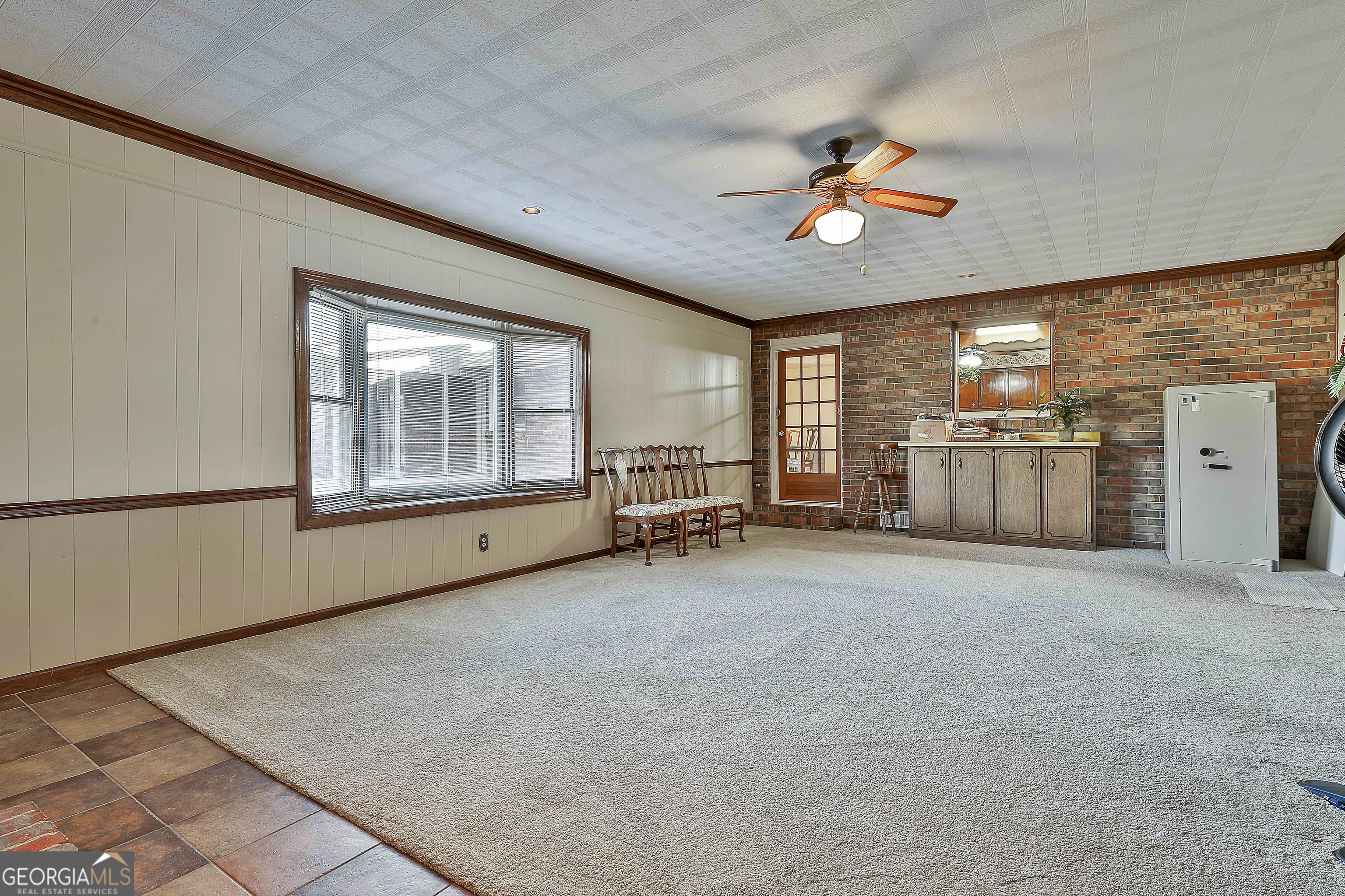 910 Line Creek Road Senoia, GA 30276 - Photo 23 of 56 a view of a livingroom with furniture and ceiling fan