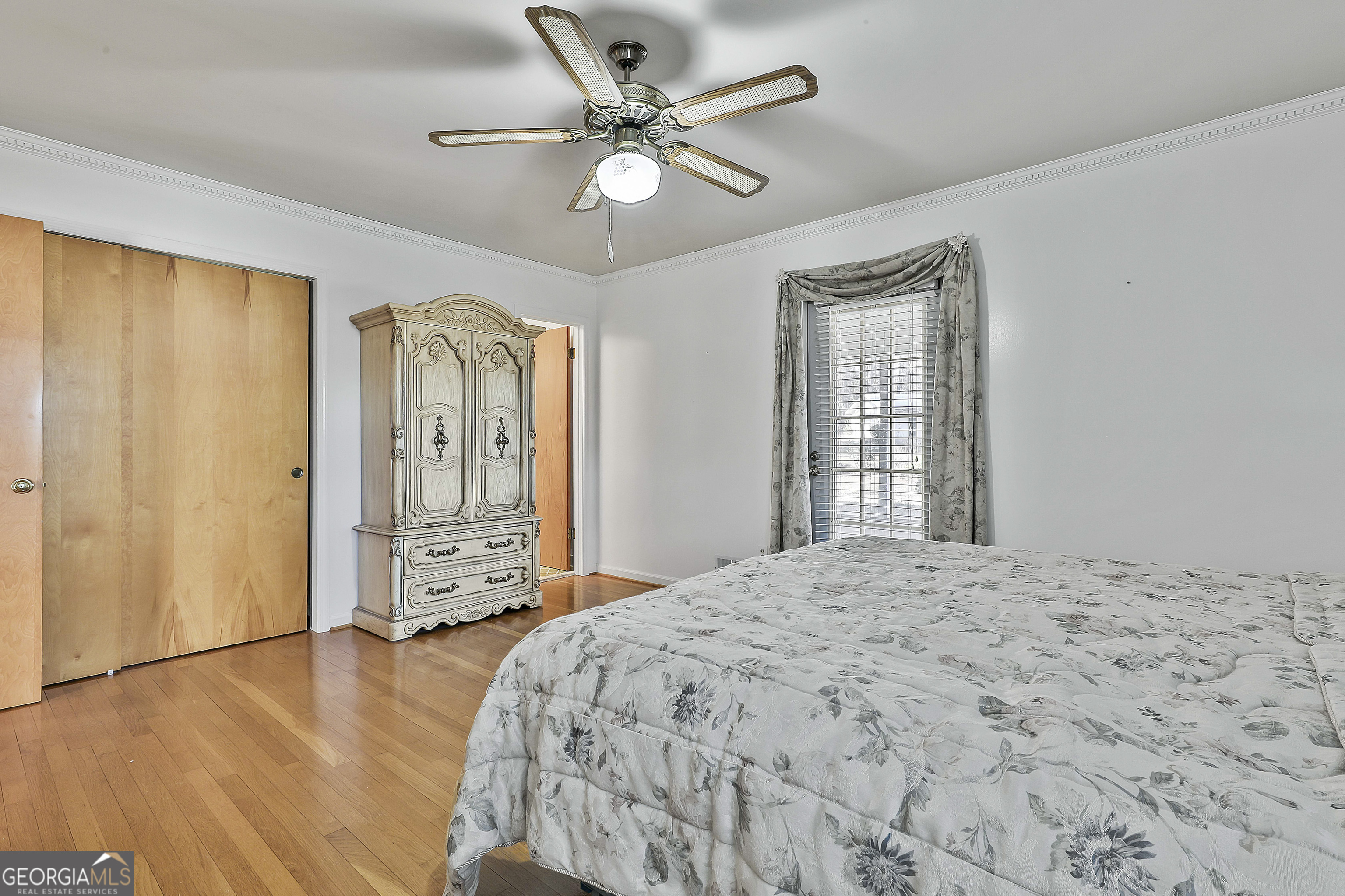 910 Line Creek Road Senoia, GA 30276 - Photo 27 of 56 a bedroom with a bed dresser and a window