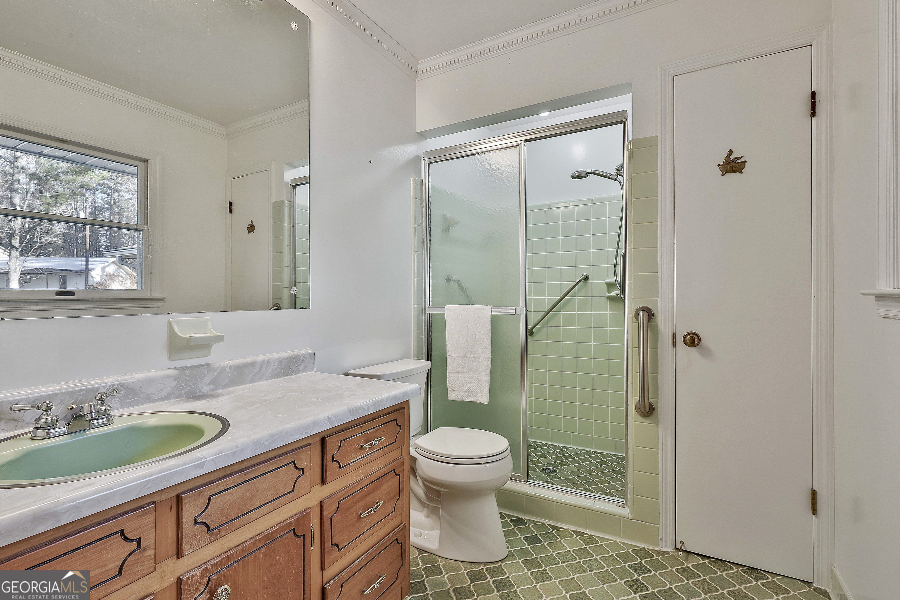910 Line Creek Road Senoia, GA 30276 - Photo 28 of 56 a bathroom with a granite countertop sink toilet and shower
