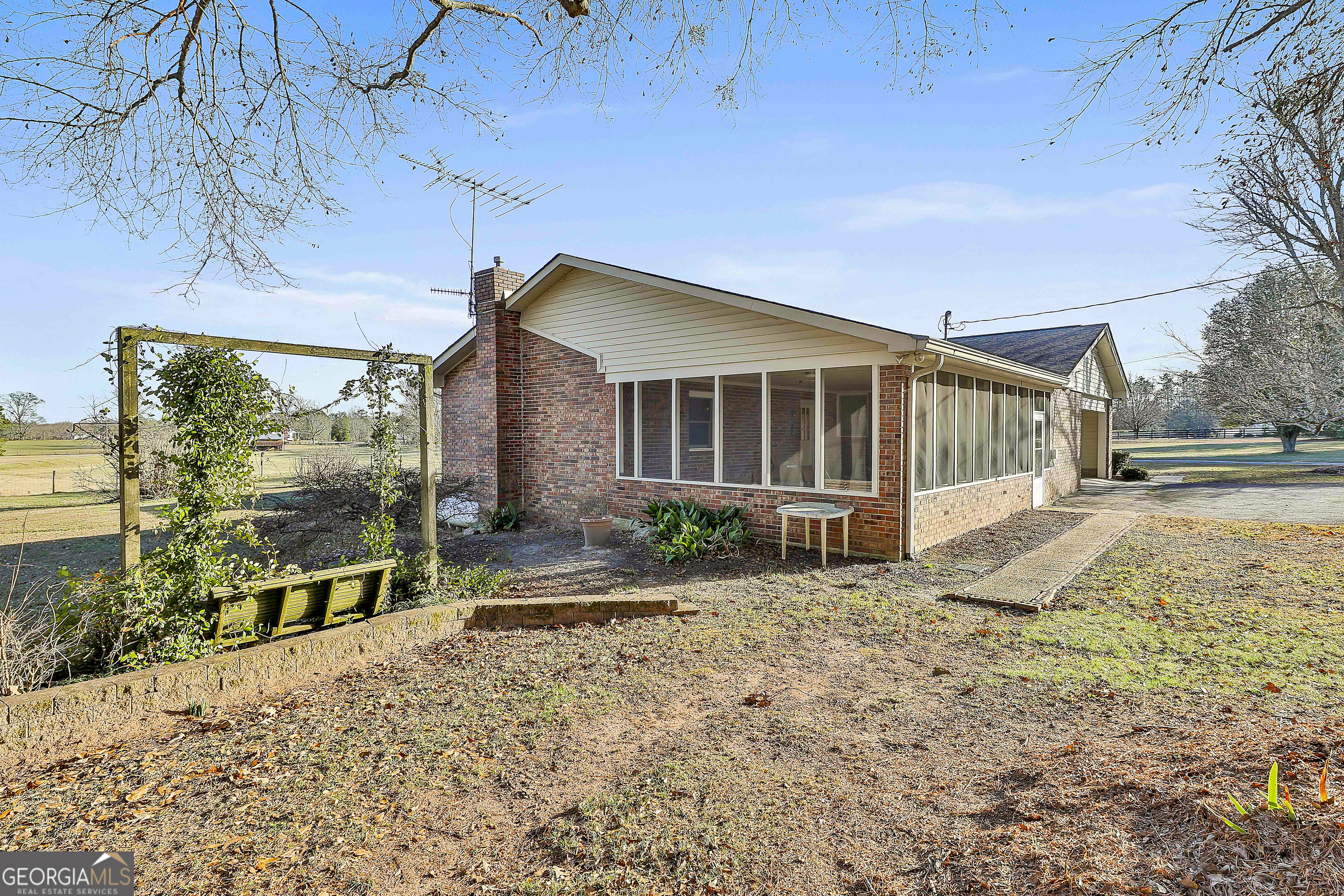 910 Line Creek Road Senoia, GA 30276 - Photo 34 of 56 a view of a house with backyard and sitting area