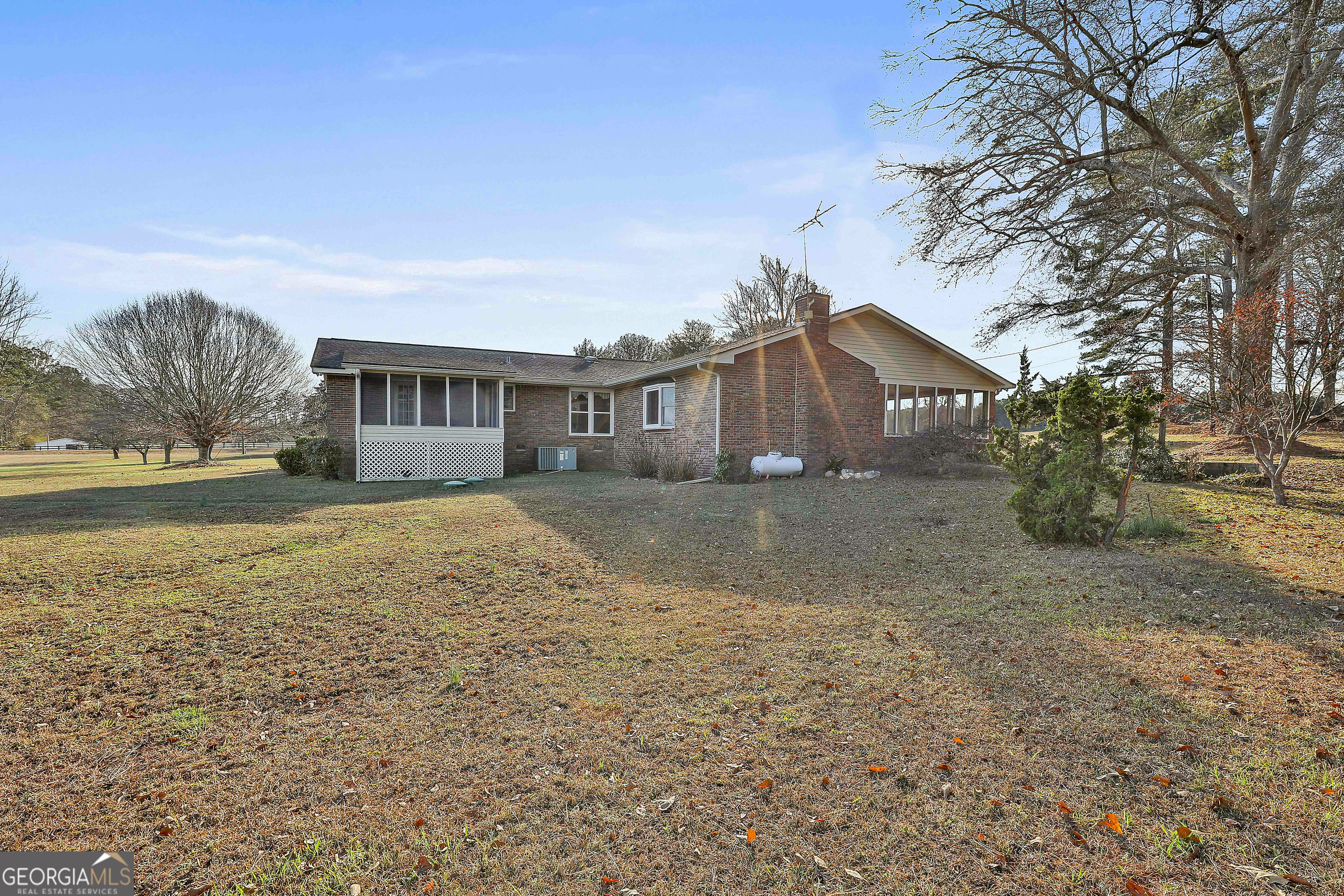 910 Line Creek Road Senoia, GA 30276 - Photo 35 of 56 a view of house with yard and lake view