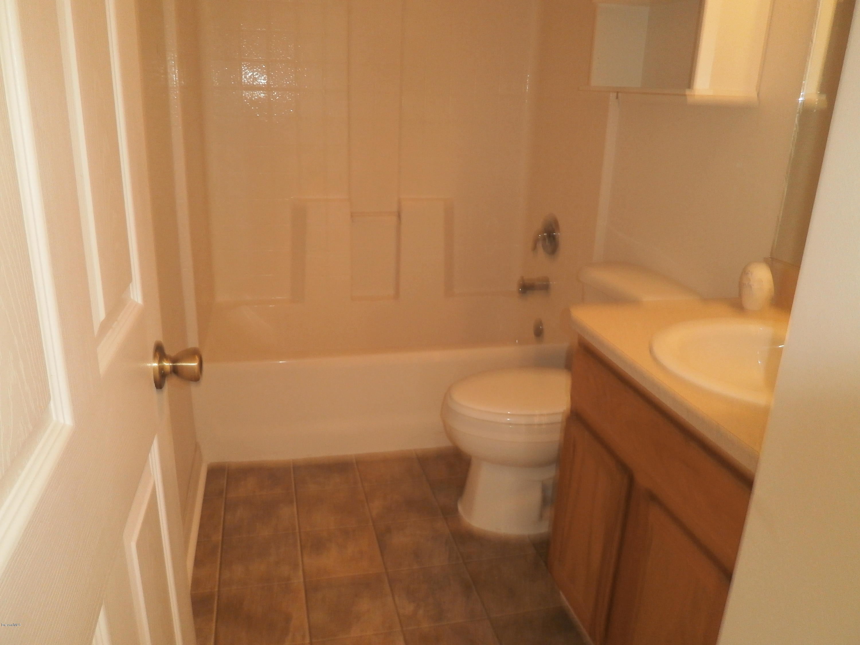 2784 Digby Road Southeast Palm Bay, FL 32909 - Photo 12 of 19 a bathroom with a toilet and shower