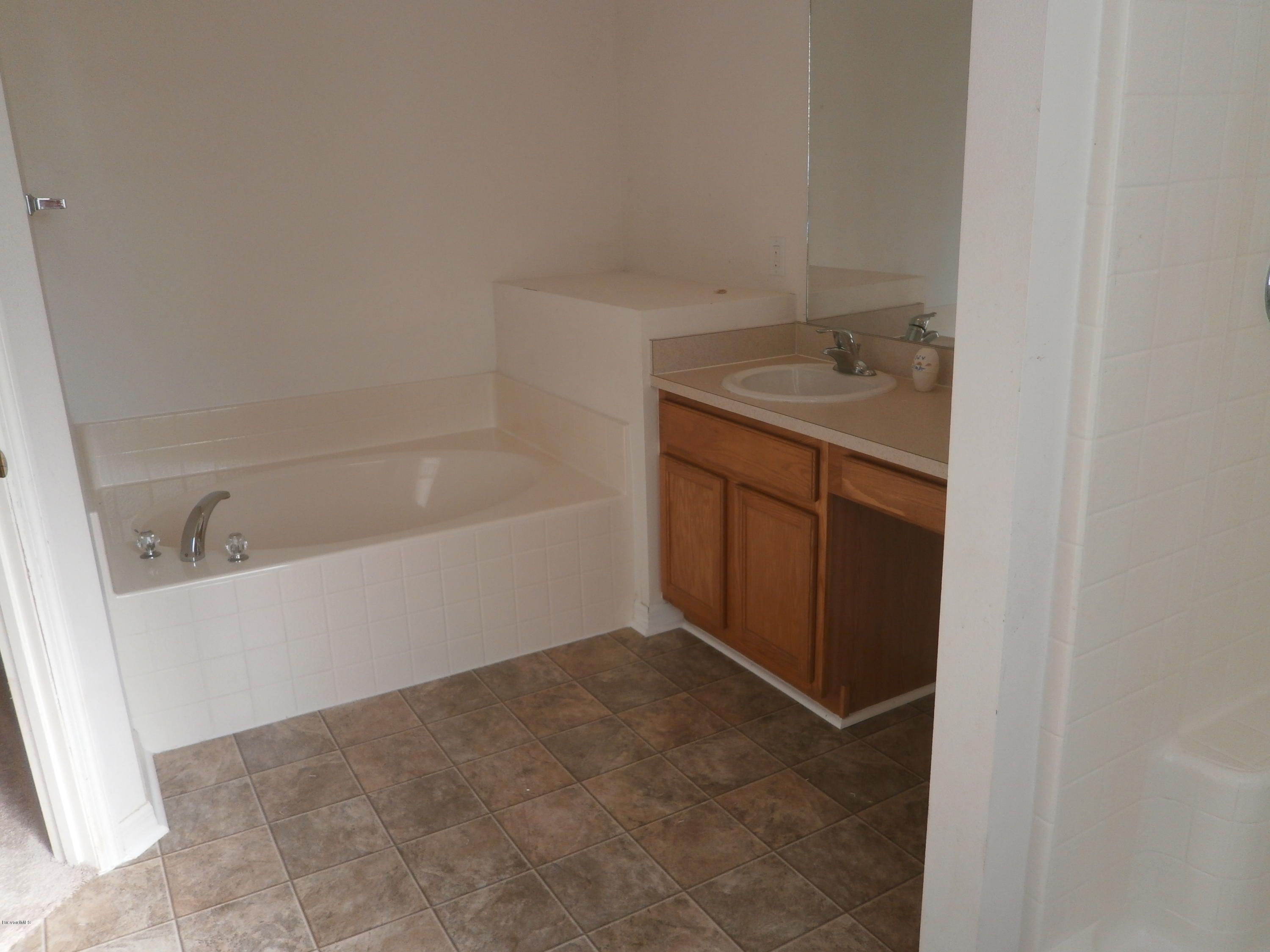 2784 Digby Road Southeast Palm Bay, FL 32909 - Photo 15 of 19 a bathroom with a sink and a bathtub