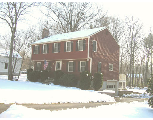 29 Acorn Road Northbridge, MA 01588 - Photo 4 of 9 a front view of a house with a yard covered in snow