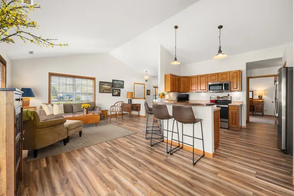 a living room with furniture or kitchen and a wooden floor