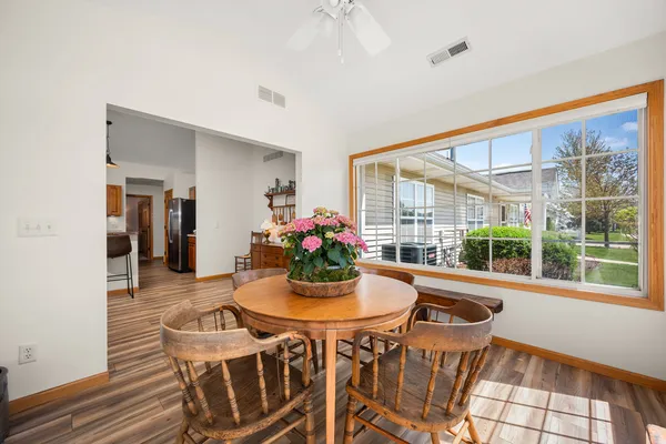 a dining room with furniture and window