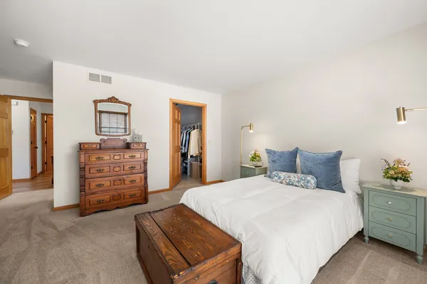 a bedroom with a bed and furniture