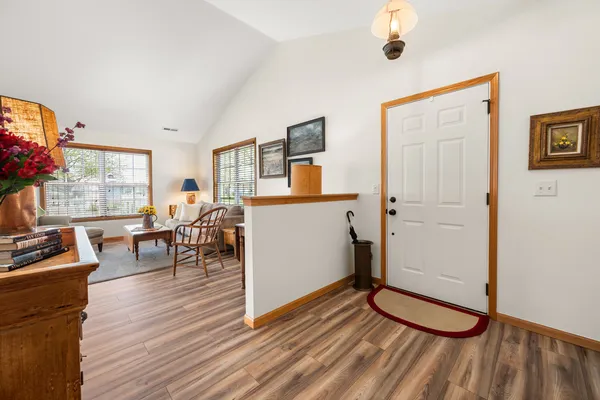 a view of a livingroom with furniture and hardwood floor