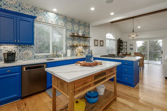 a kitchen with a sink appliances and cabinets