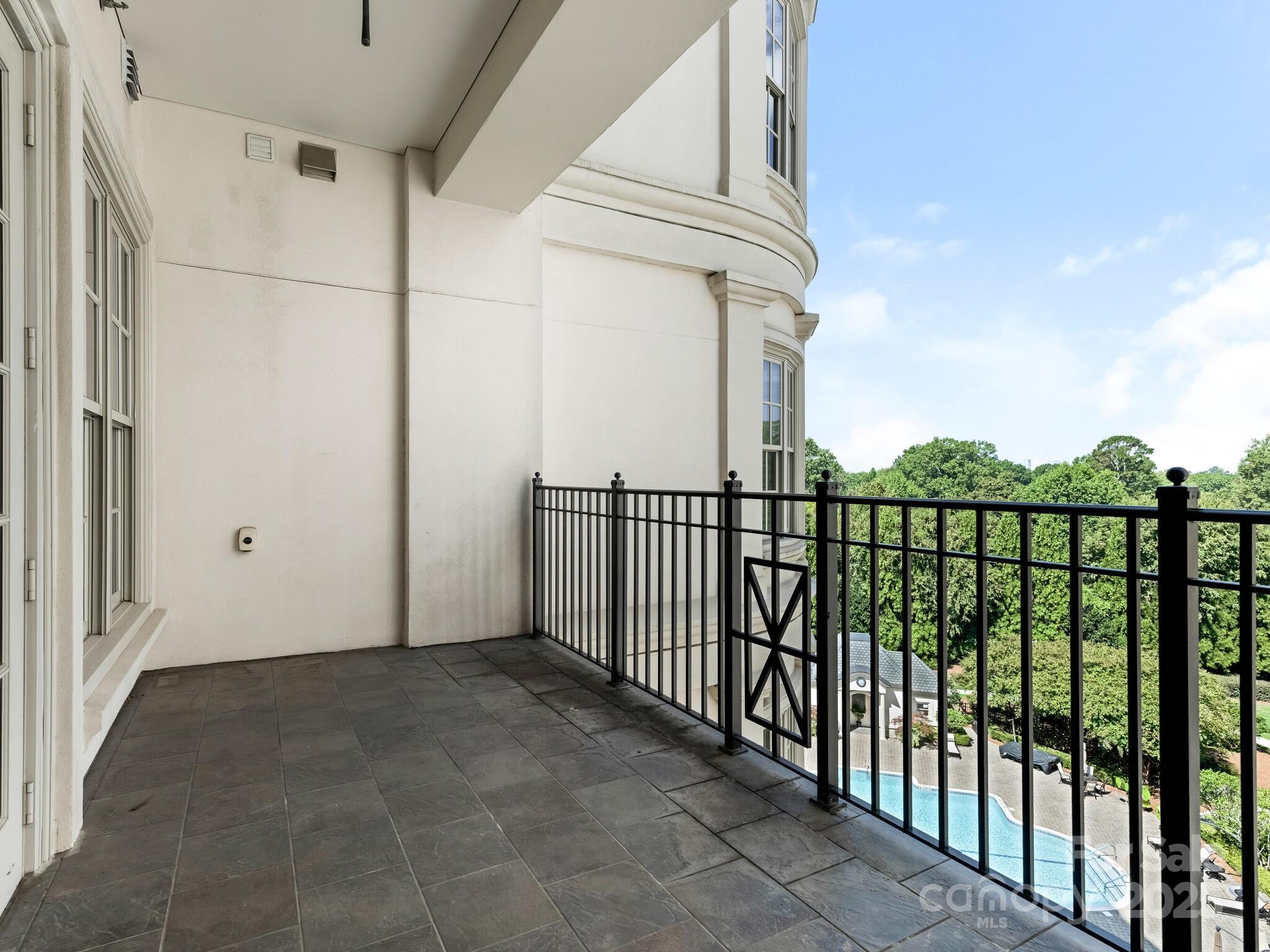 2823 Providence Road, Unit 152 Charlotte, NC 28211 - Photo 25 of 41 a view of a balcony with wooden floor and fence