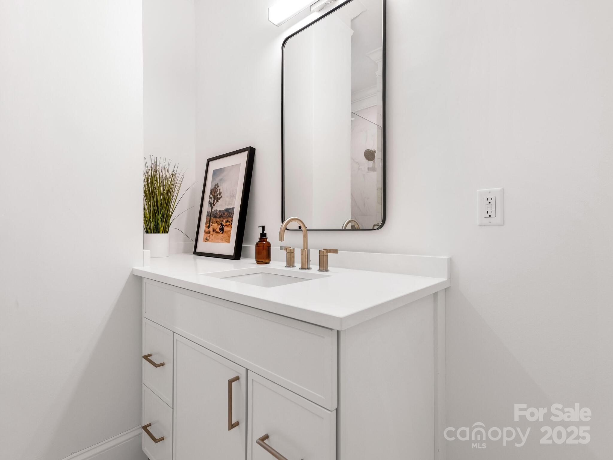 2823 Providence Road, Unit 152 Charlotte, NC 28211 - Photo 29 of 41 a bathroom with a sink and a mirror